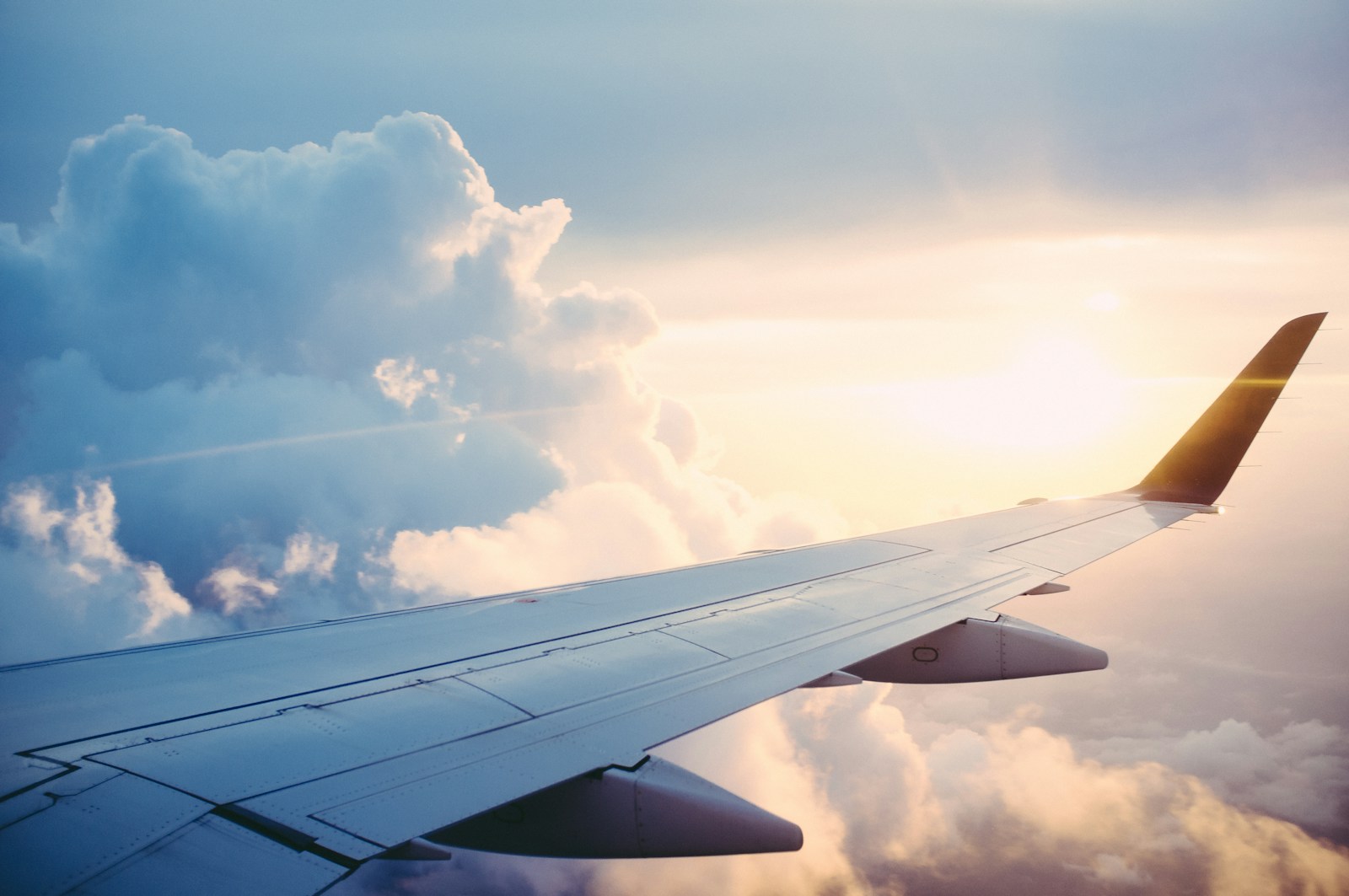 Airplane above a bright coastline